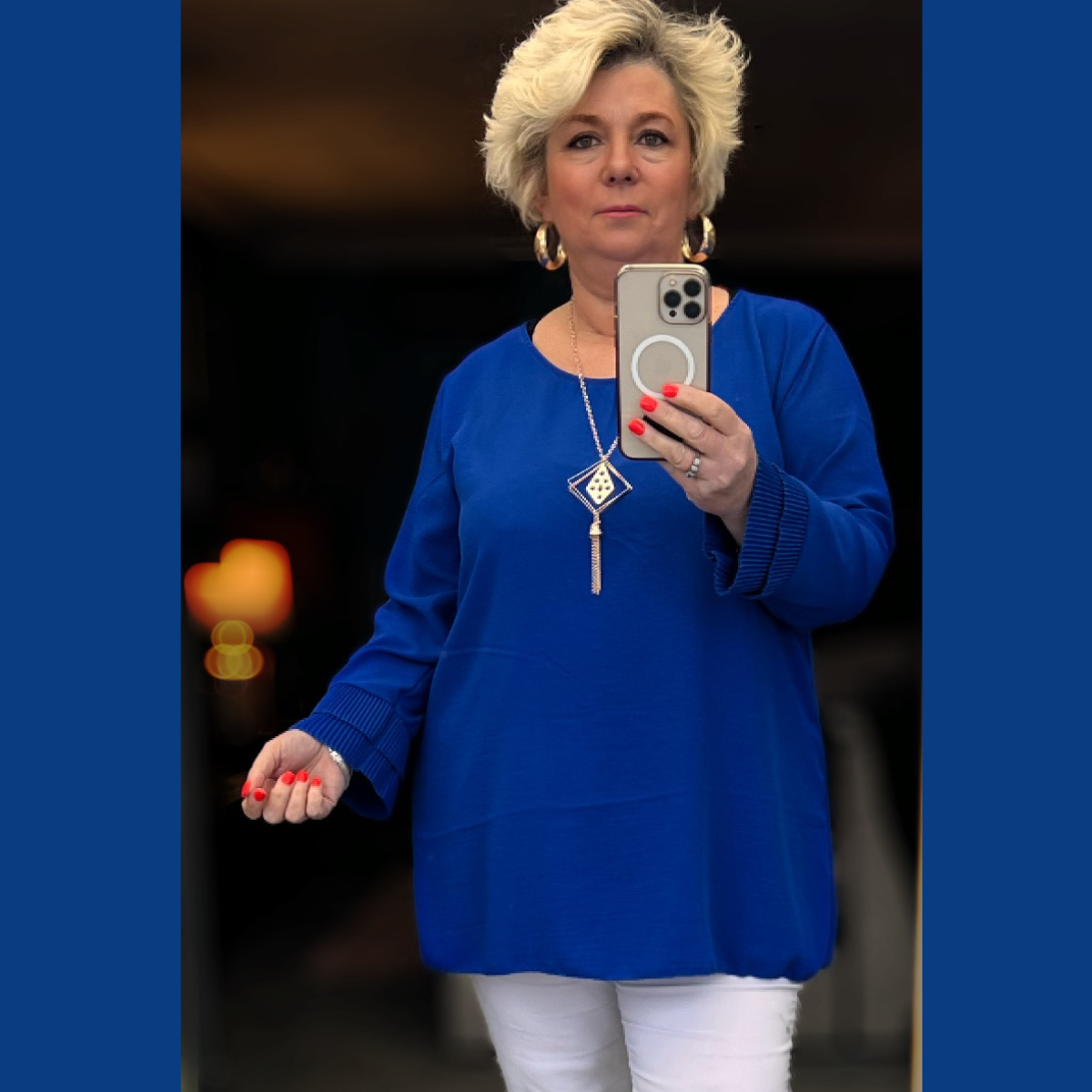 Straight Cut blouse with frilled cuffs and necklace