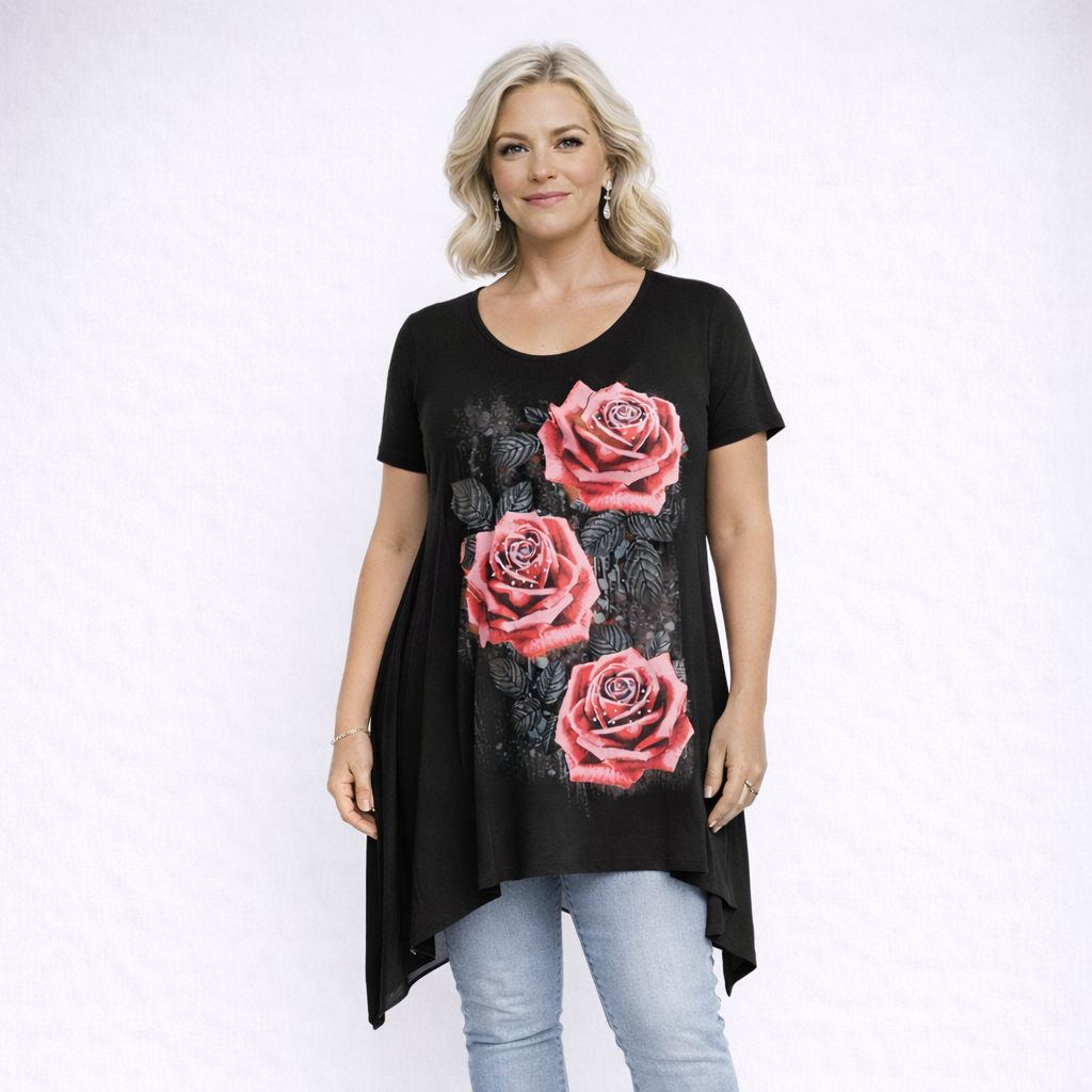 Woman wearing a black t-shirt with pink rose designs on a white background