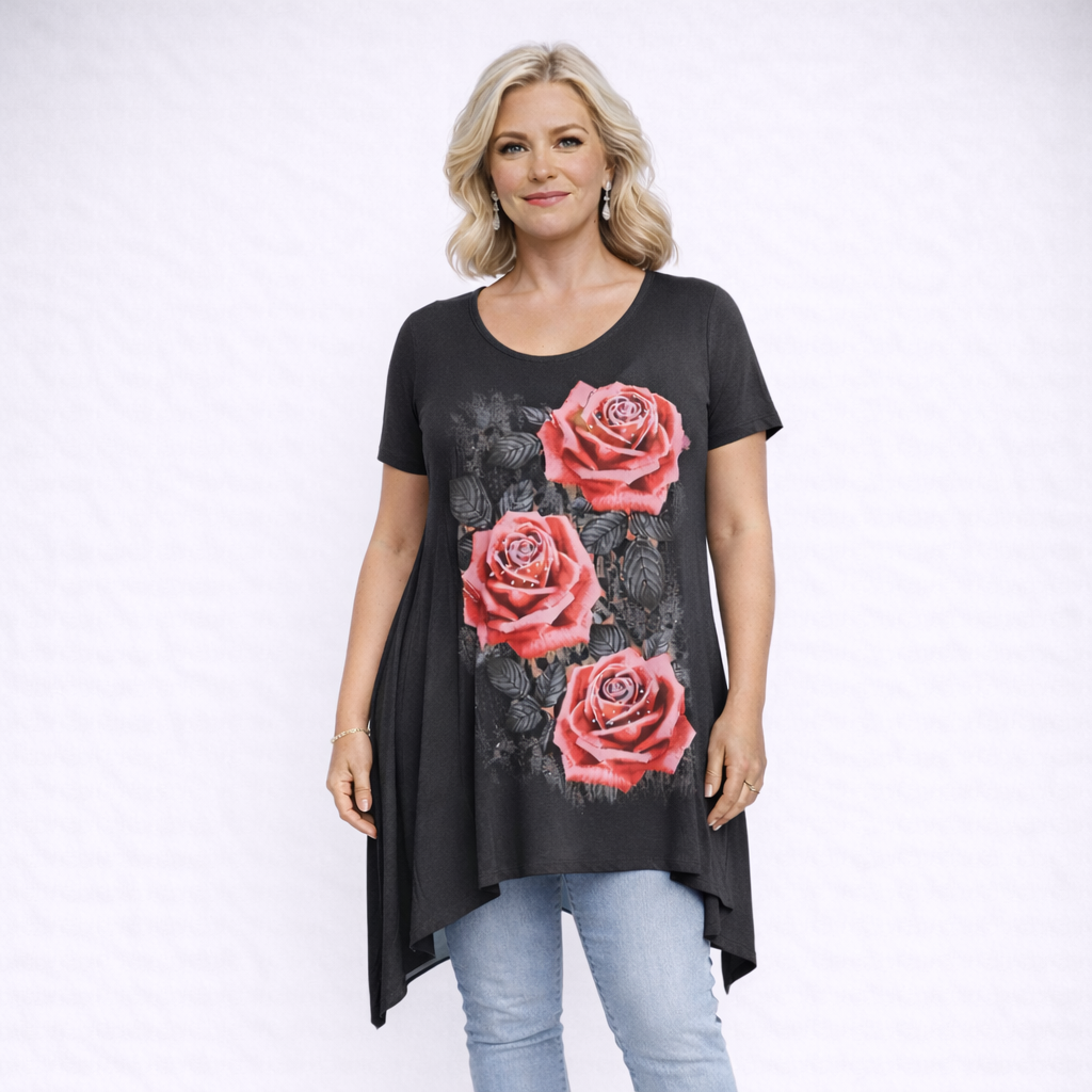 Woman wearing a black t-shirt with pink rose designs on a white background