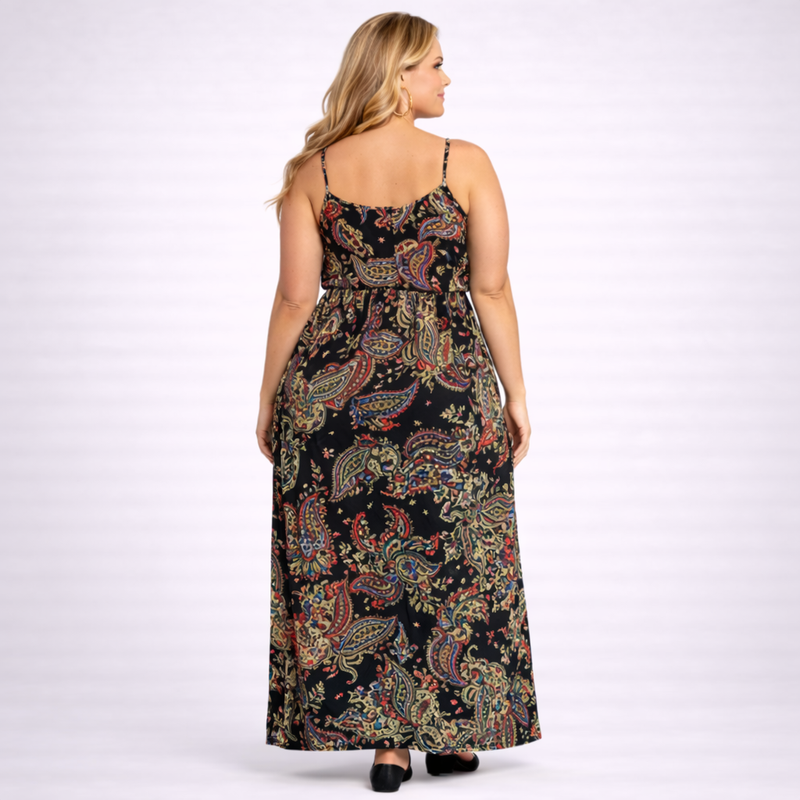 Woman wearing a long, patterned dress on a white background