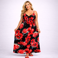 Woman wearing a black dress with red floral pattern on a white background