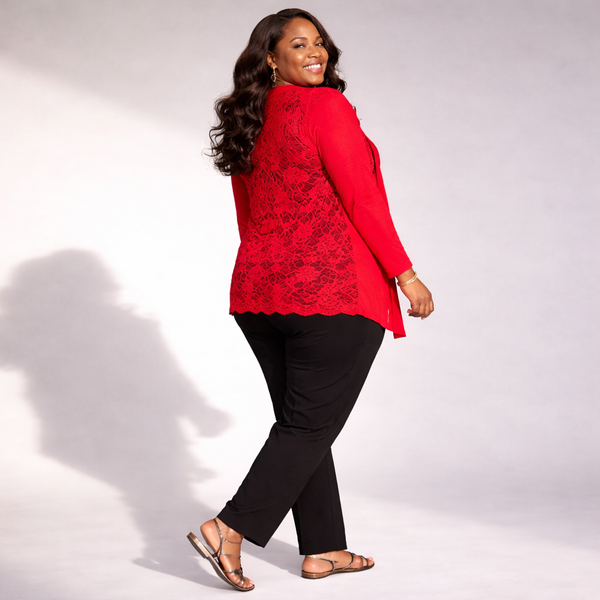 Woman wearing a red jacket with black lace details and black pants on a white background