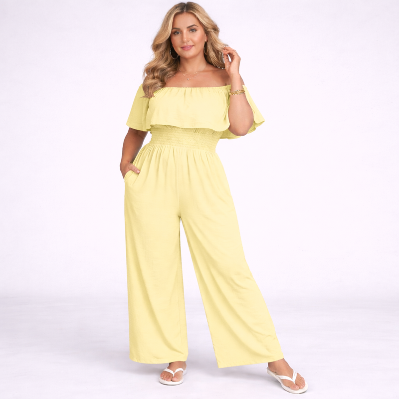 Woman wearing a yellow off-shoulder jumpsuit on a white background