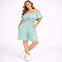 Woman wearing a light blue off-shoulder romper on a white background