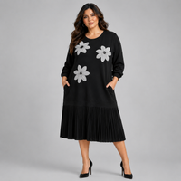 Black Dress with Applique and Pleated Skirt