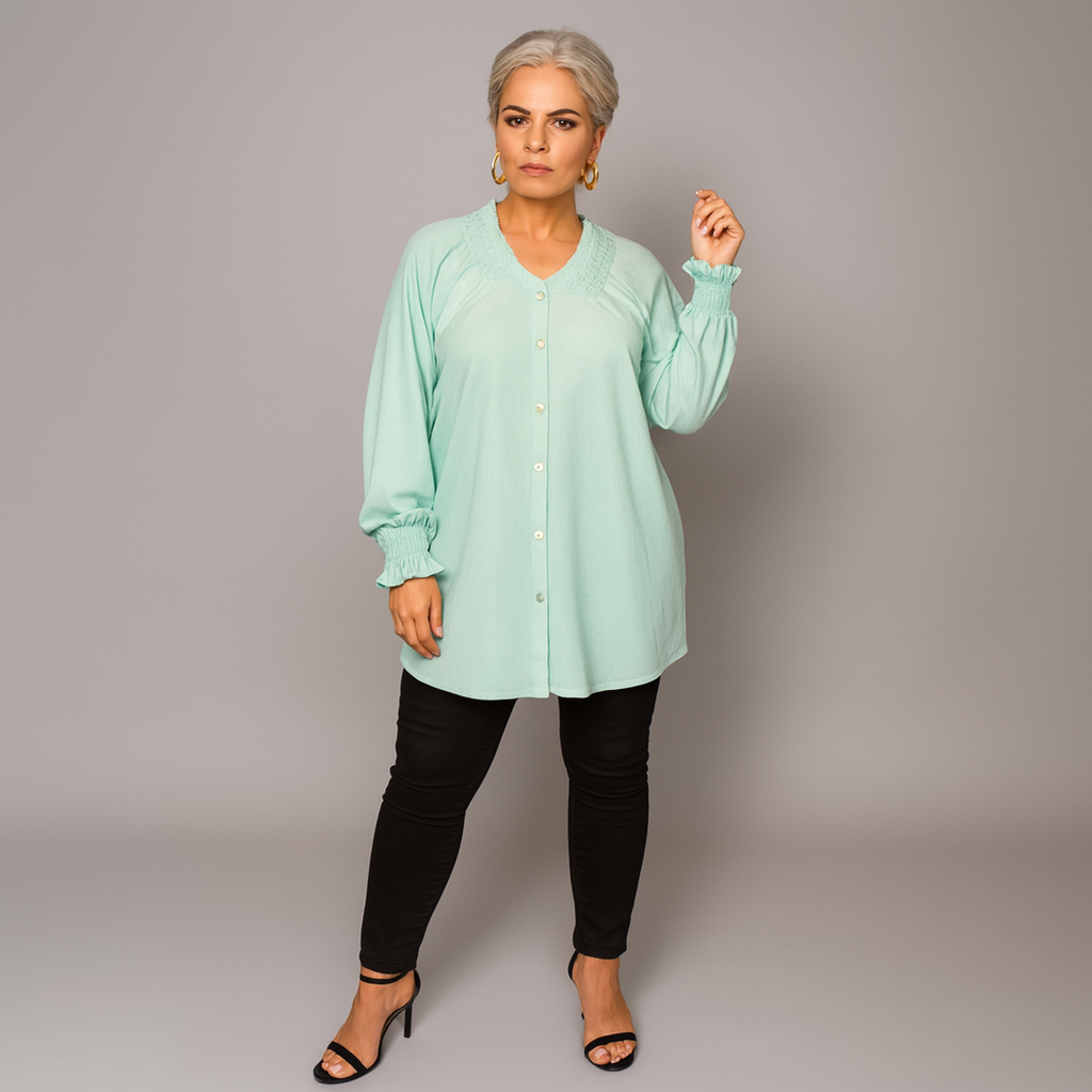 Smocked V‑Neck Long Sleeve Blouse
