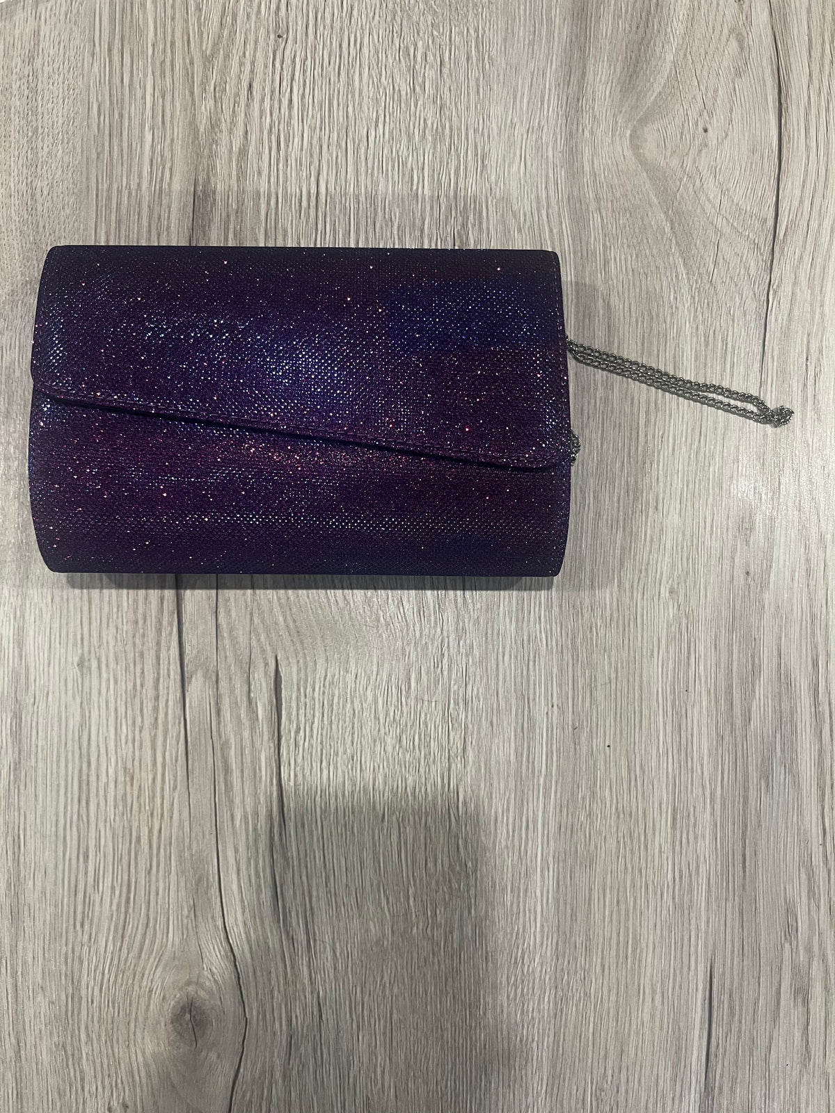 purple glitter clutch bag