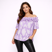 Woman wearing a purple off-shoulder top with floral details on a white background