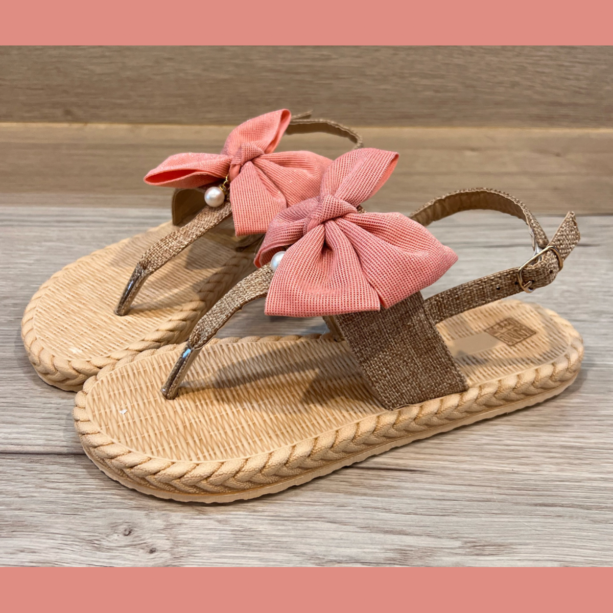 Printed sole flat sandals with large bow and pearl drop