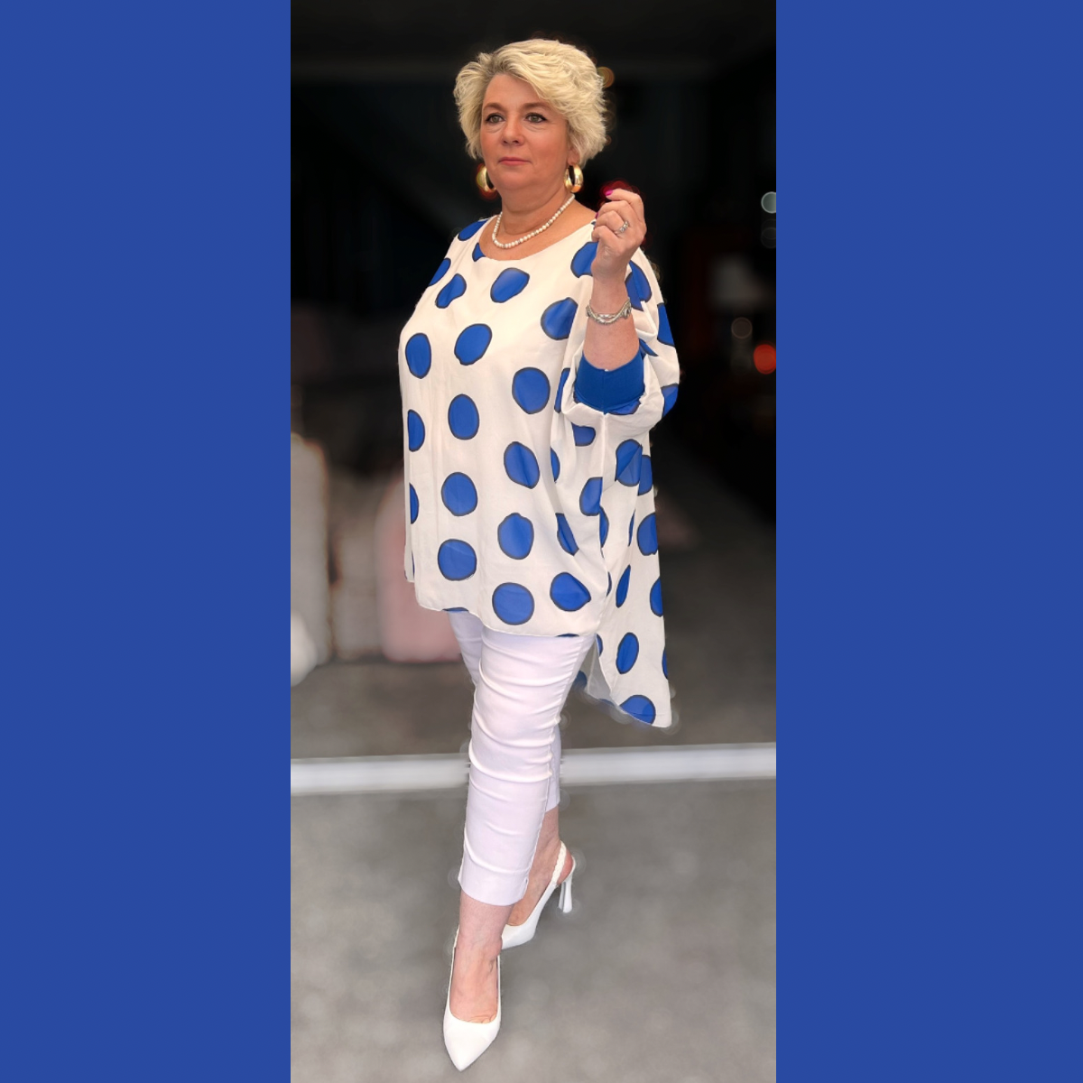 LARGE SPOT LONG DIPPED HEM BUTTON SLEEVE BLOUSE