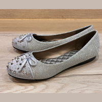 Sparkly spiked toe cap flat shoes with bow