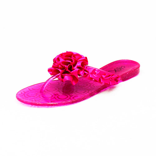 Pink jelly flip flop flops with rosette front
