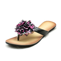 Black with pink edged rosette flat sandals / flip flops