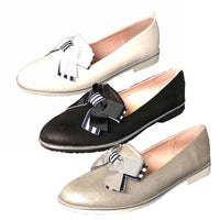Flat loafer style shoes with bow detail