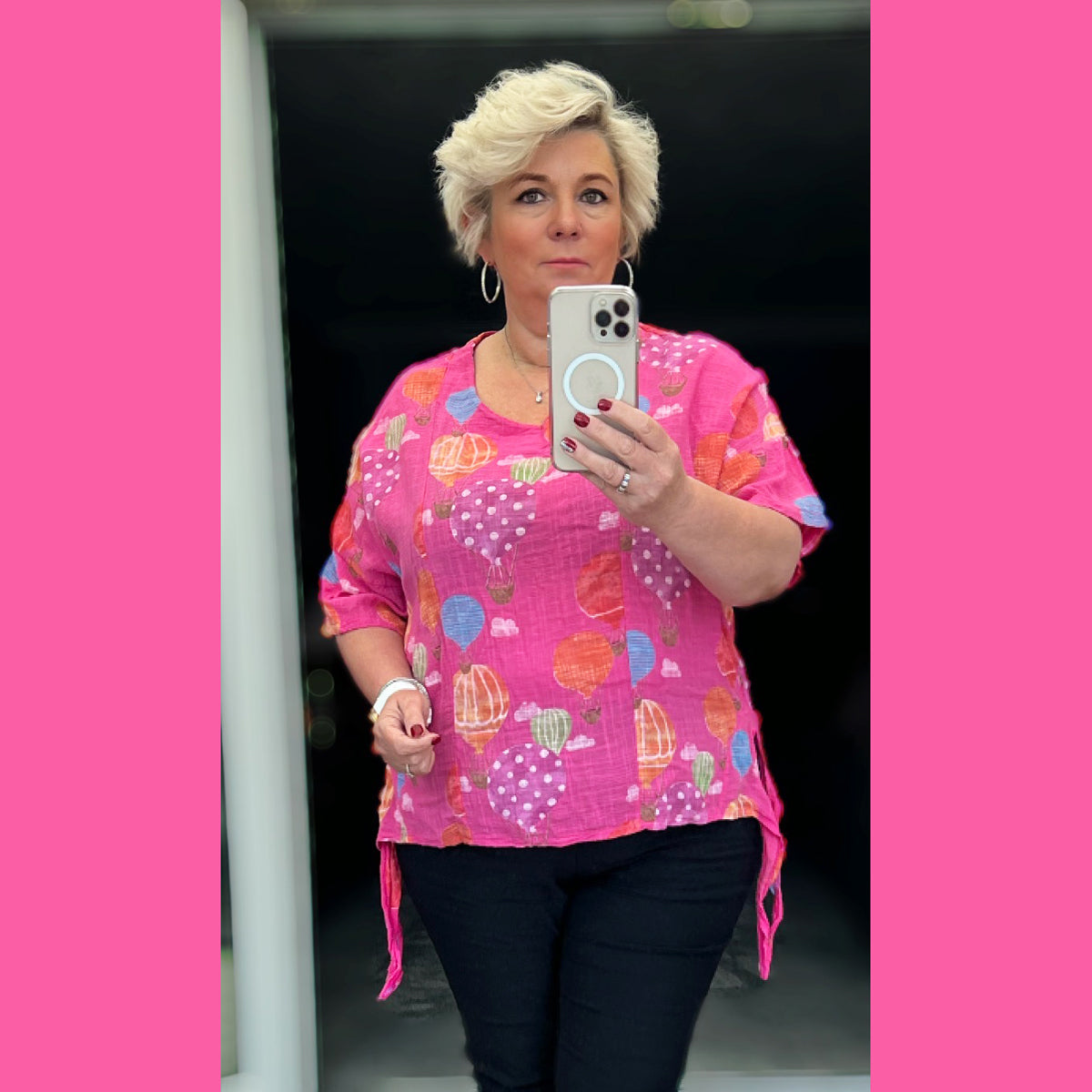 Bright pink summer top with balloon print and side tie detail