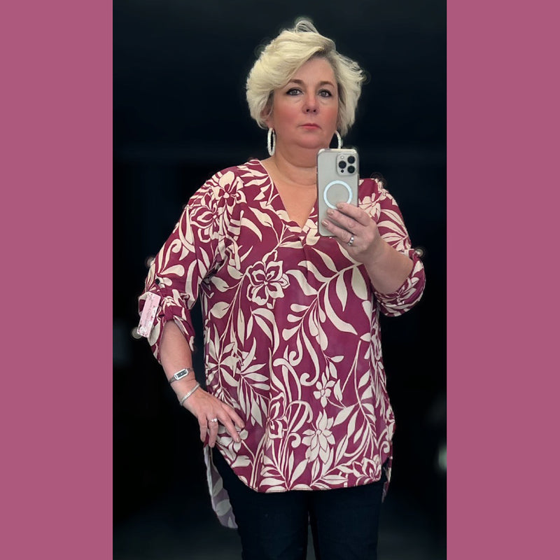 Loose fitting v neck dipped hem blouse / top